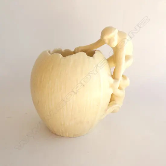 A Sylvac vase monkeys on coconut